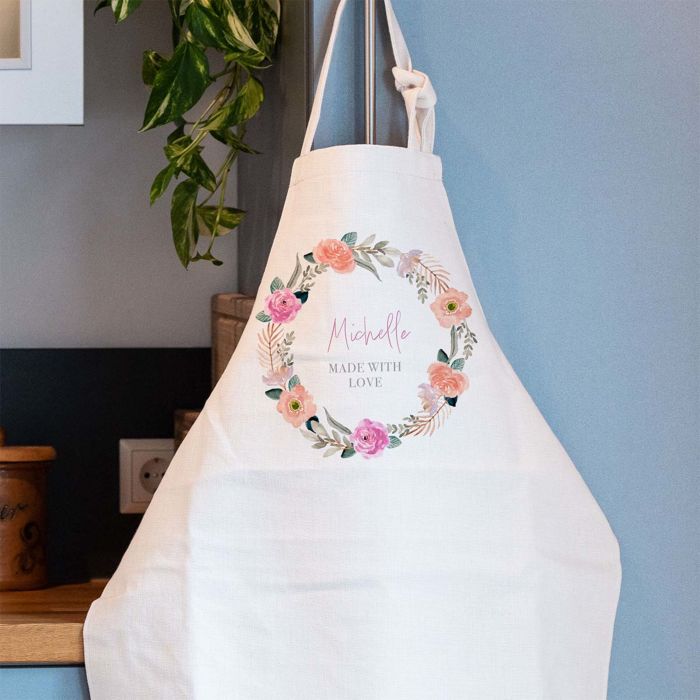 Gepersonaliseerde keukenschort met bloemenkrans en tekst